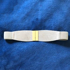 Elastic belt with gold accessories